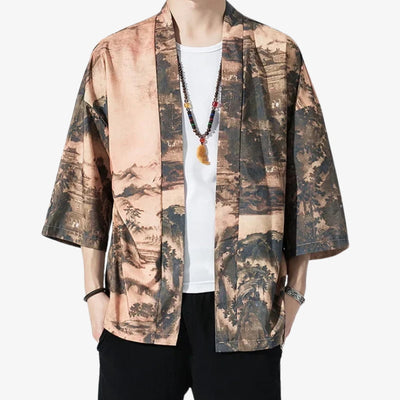 Person wearing a streetwear kimono jacket with a landscape pattern on a white background