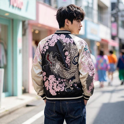Person wearing a stylish sukajan embroidered bomber jacket with dragon and floral designs on a Harajuku street.