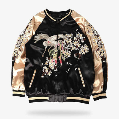 This sukajan jacket sakura is a women's bomber with a motif of Japanese cherry blossom and flying birdembroidery and sakura flowers. The jacket is made of satin in black and gold.