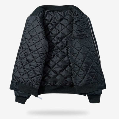 This sukajan style bomber jacket is fleece-lined. Black coat with long sleeves and black color