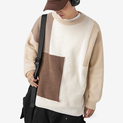 A man is dressed with a sweater Japanese in a cream color, made from a high-quality blend of cashmere and polyester for ultimate comfort and style