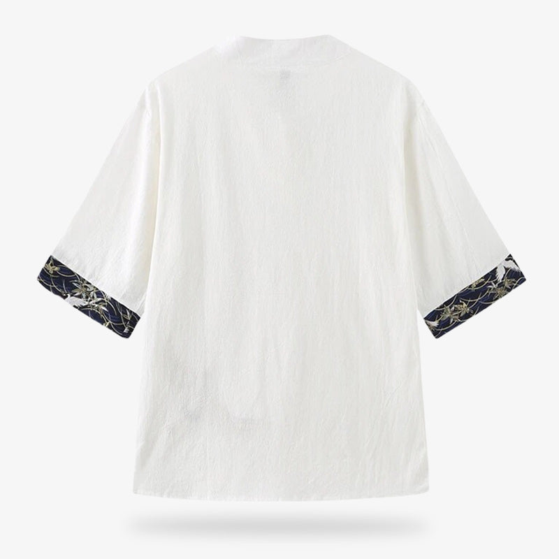 A Japanese t-shirt with embroidery on the short sleeves of the white fabric