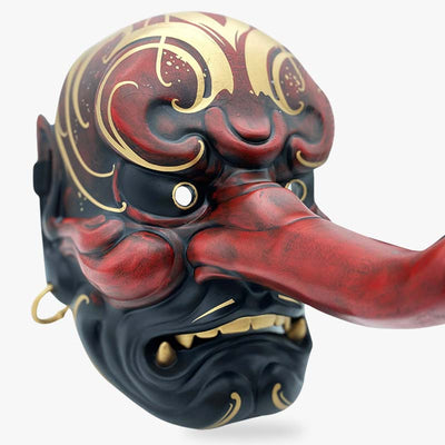 The tengu japanese mask is red and gold. The demon oni mask has a big noise