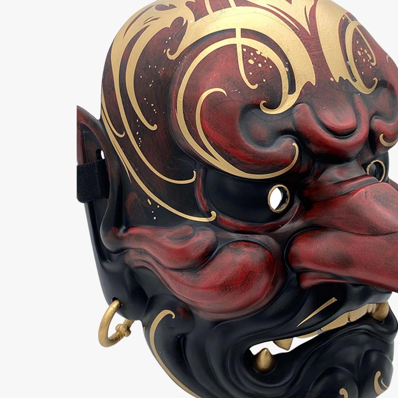 Tengu mask japanese with black red and gold color. Material use for the mask is wood and resin