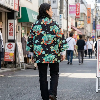 Woman seen from behind wearing a haori streetwear in a Harajuku street