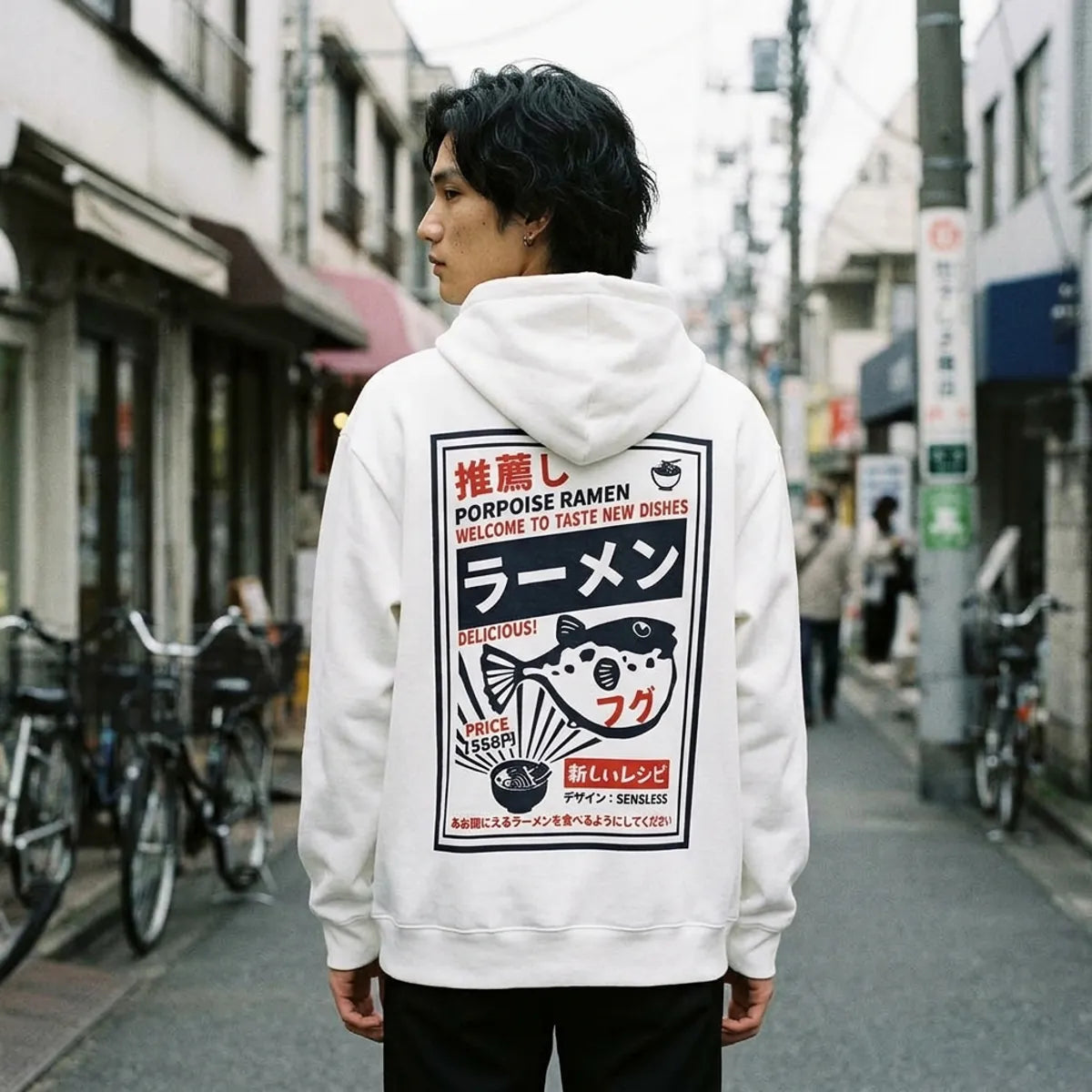 Back view of the white hoodie displaying the large retro ramen menu poster print