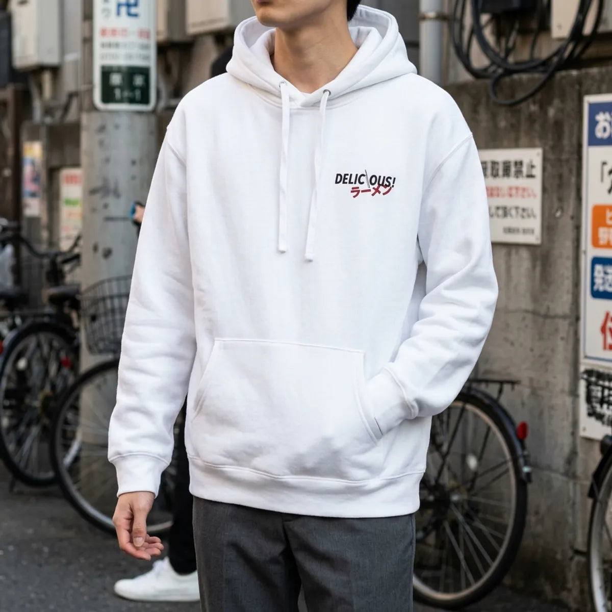 Close view of the katakana ramen graphic printed beneath the Delicious text on the hoodie