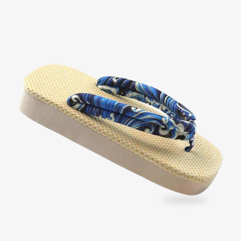 Tradi zori flip flops combining modern comfort with Japanese aesthetics. The strap of the japanese flip flop are blue with wave pattern. The zori geta is made with quality material with Japanese wave pattern