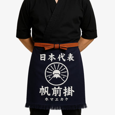 Traditional cooking apron in navy cotton with white kanji, reflecting authentic Japanese design and high-quality craftsmanship.