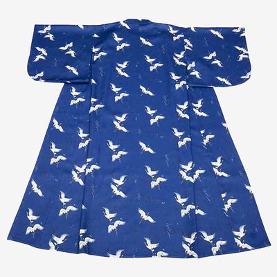 a traditional purple kimono with whit japanese birds pattern