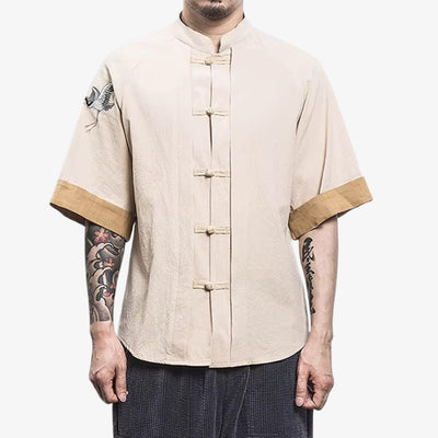a man is dressed with Tsuru shirt featuring crane (tsuru) motifs embroidered on cream color cotton, symbolizing longevity and peace in Japanese culture, rendered in elegant graphic form.