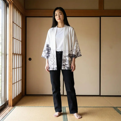 Woman wearing a kimono dragon in a washitsu room with tatami and shoji screens