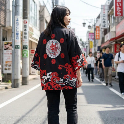 Woman seen from behind wearing a haori black in a Harajuku street