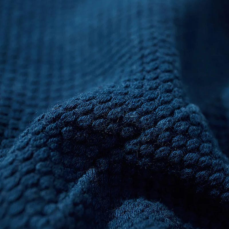 The Vintage kimono jacket material featuring a minimalist indigo blue design, reflecting traditional Japanese aesthetics and timeless elegance