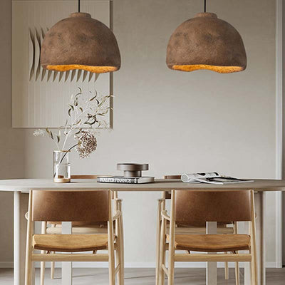 Two wabi sabi Japanese chandelier with a white table and wood chairs