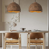 Two wabi sabi Japanese chandelier with a white table and wood chairs