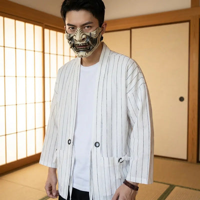Man wearing a white haori jacket in a Japanese washitsu room with shoji screens, waist-up front view