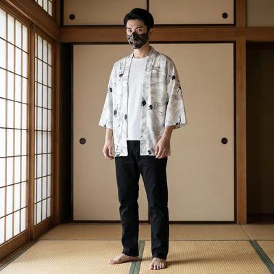 Man wearing a white haori in a traditional Japanese washitsu room, front view