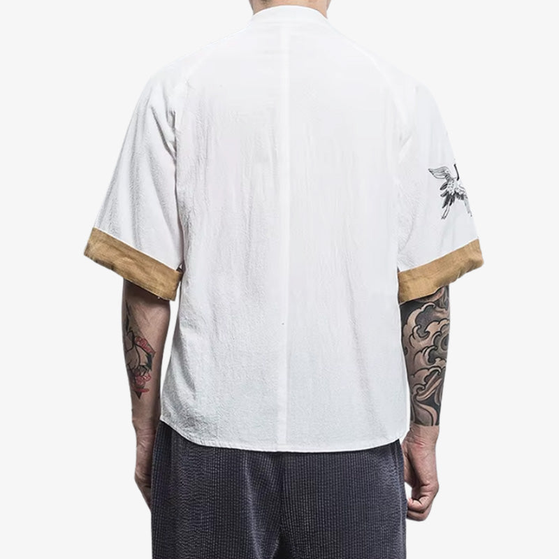 A man with irezumi tattoo, is dressed with white japanese tee-shirt made with cotton