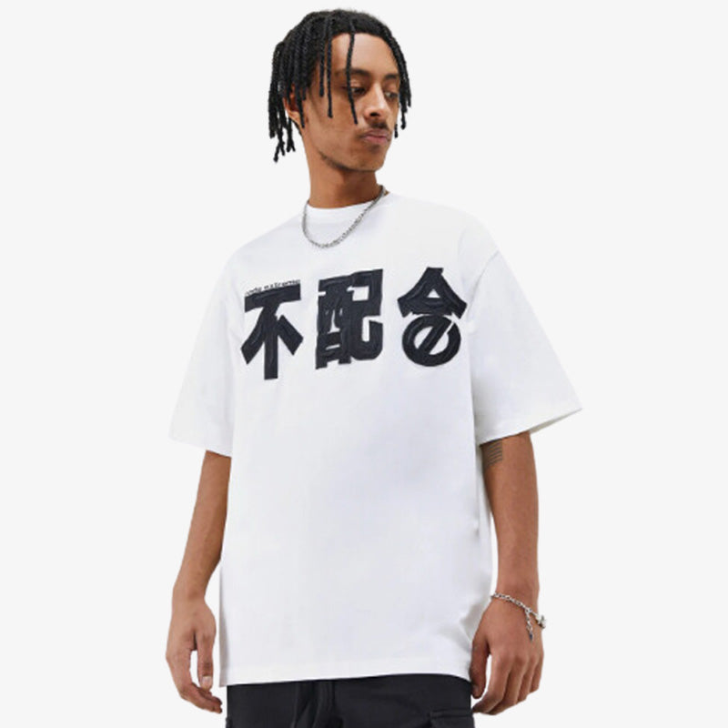 a black men is dressed with a White kanji t-shirt with subtle Japanese calligraphy, designed for a clean, cultural, and modern aesthetic.