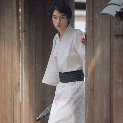The white kimono japanese men is a symbol of purity and sophistication, perfect for tea ceremonies and special occasions. The traditional kimono is holden with a samurai obi belt