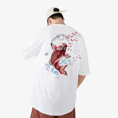 Person wearing a white Koi shirt with a red koi fish design on the back, standing against a white background.