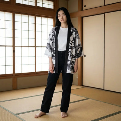 Woman wearing a hannya kimono in a washitsu room with tatami and shoji screens