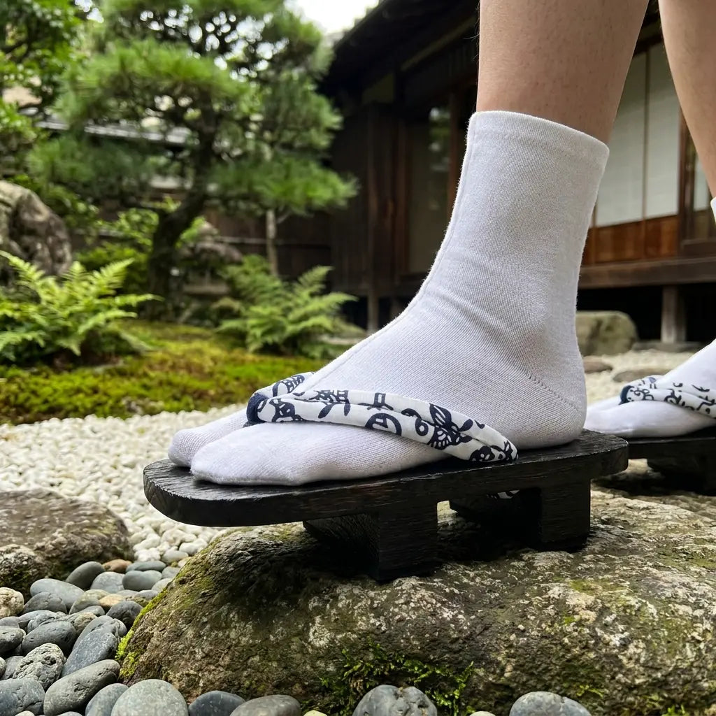 Close-up of the wood grain and white hanao on a Japanese sandal