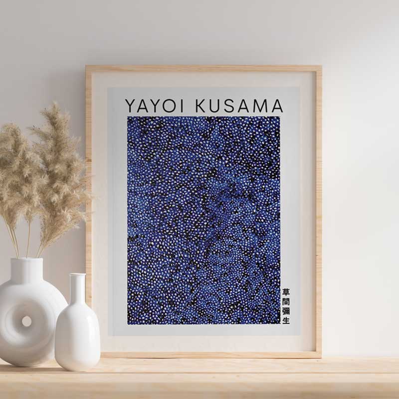 This yayoi kusama famous paintings is an abstract japanese work of art. The japanese painting is on a shelve in wood. The painting frame is also in  light wood