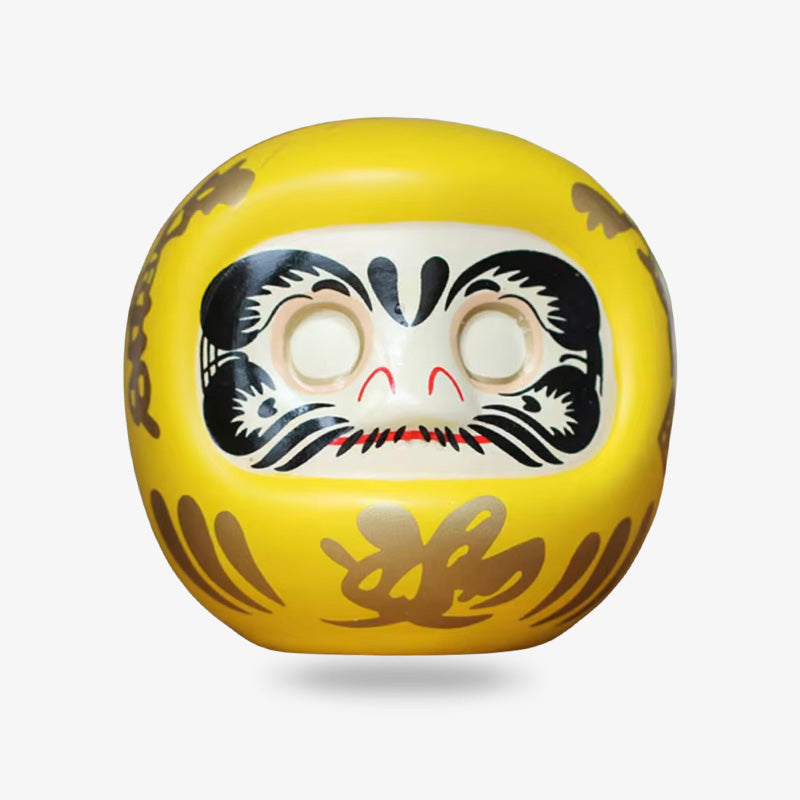 Yellow Daruma doll is a charm for prosperity, symbolizing financial growth and stability.