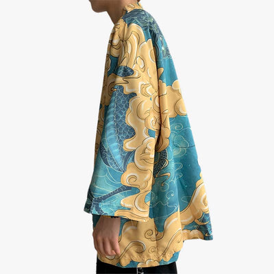 A man in profile is wearing a pretty Haori Harajuku Japan kimono in yellow and blue.