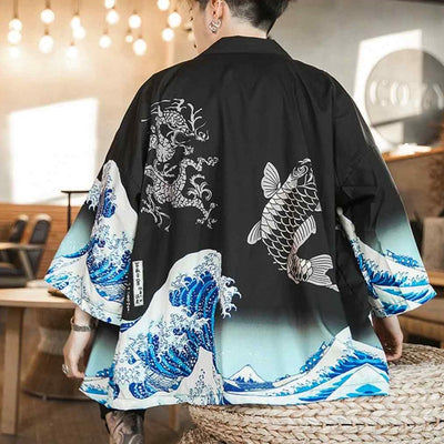 a japanese man is wearing a haori design with great wave of kanagawa, a japanese dragon and a koi carp. Material is cotton with black and blue color for this kimono jacket