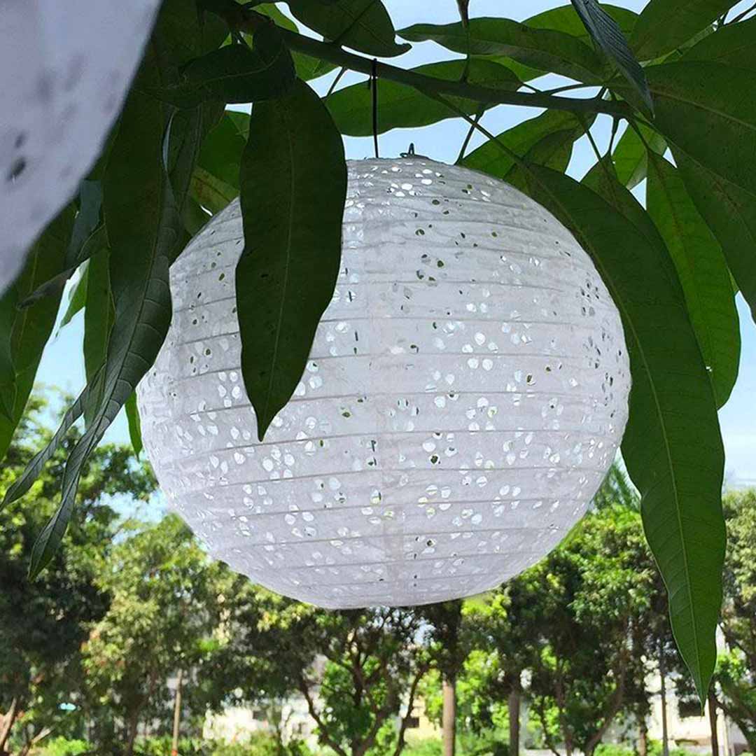 Japanese garden lantern chochin made with paper. White light lantern with a tree