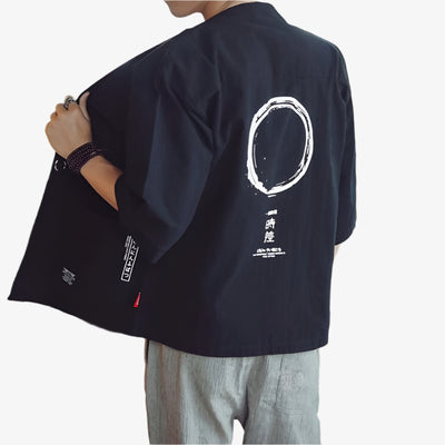 Person wearing a black Japanese Haori kimono-style jacket with white circular design on the back, on a white background.