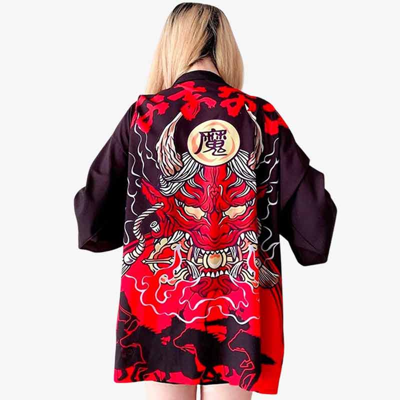 A woman wearing a red and black oni kimono style jacket pattern with a bold demon pattern design.
