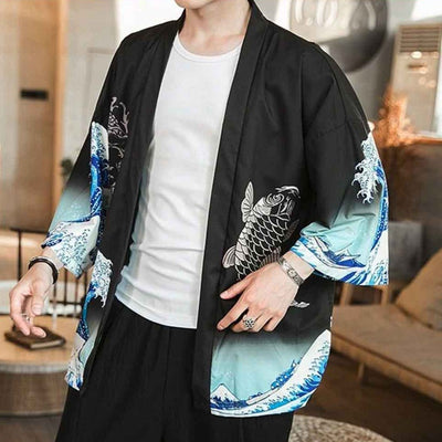 A man is wearing a japanese haori design with a koi carp pattern and the great wave of kanagawa printed on the black cotton material