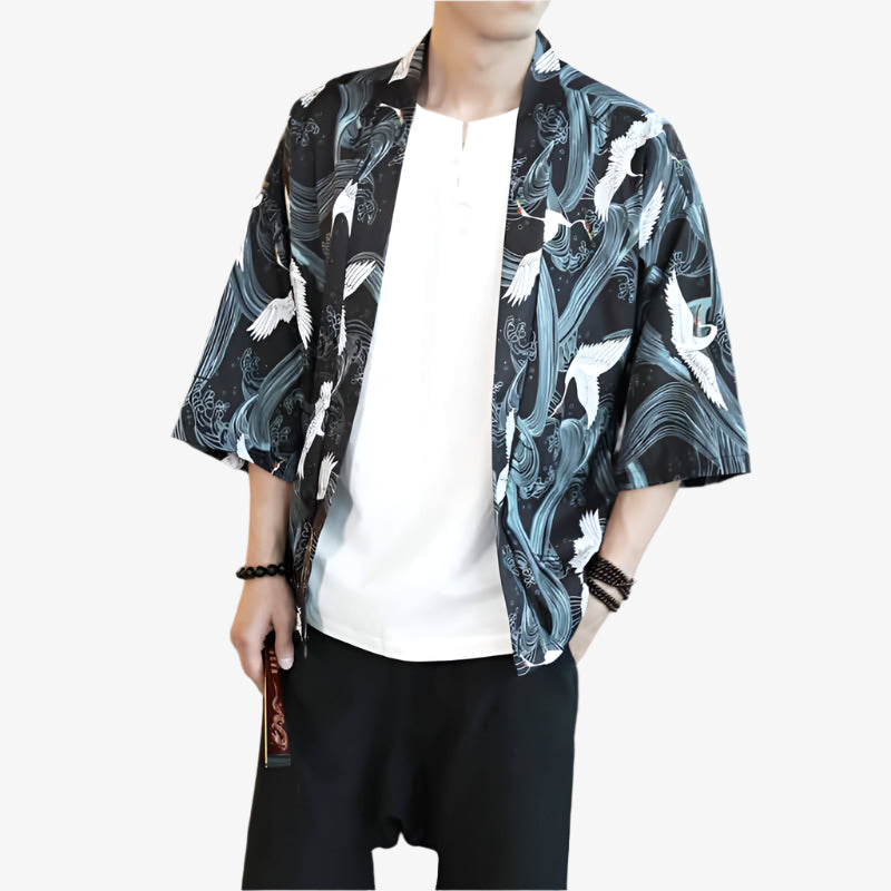 Person wearing a black and white kimono-style-mens-jacket-cranes