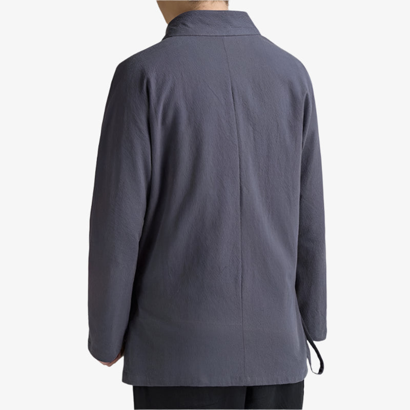 a man is dressed with Samue Japanese outfit with matching top and bottom, worn traditionally by Zen practitioners and artisans