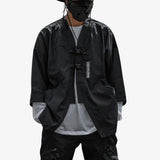 a Japanese man stands wearing a techwear jacket with a black Japanese streetwear look
