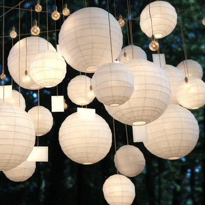 he white Japanese paper lanterns are a classic Chochin, crafted from fine paper and bamboo, providing a simple yet elegant touch to traditional Japanese decor."