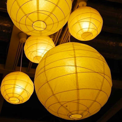 The Yellow Japanese paper Chochin is a traditional lantern, made from high-quality paper and bamboo, perfect for adding a serene and authentic ambiance to any space.