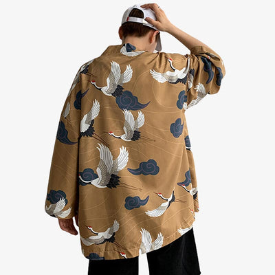 A Japanese man wearing a Yukata haori jacket and a white cap